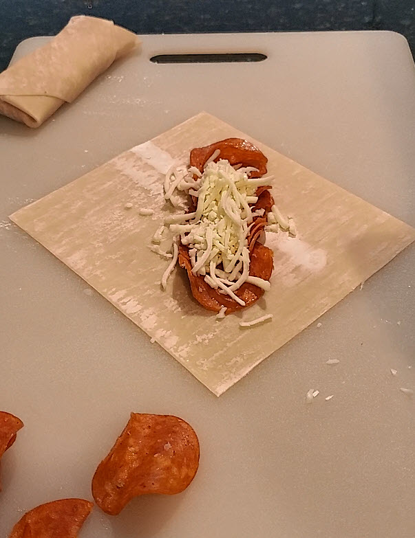 Disney Pepperoni Spring Rolls On Cutting Board