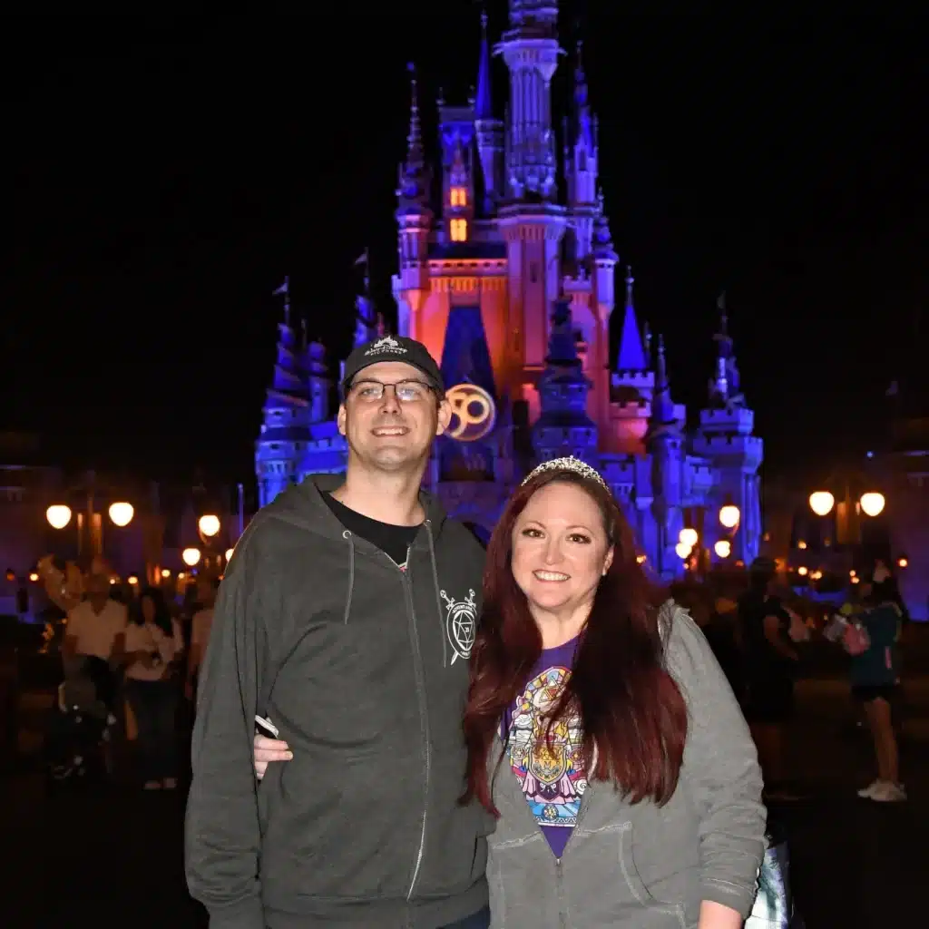 Shelley Benhoff and Jason Benhoff in front of Cinderella Castle
