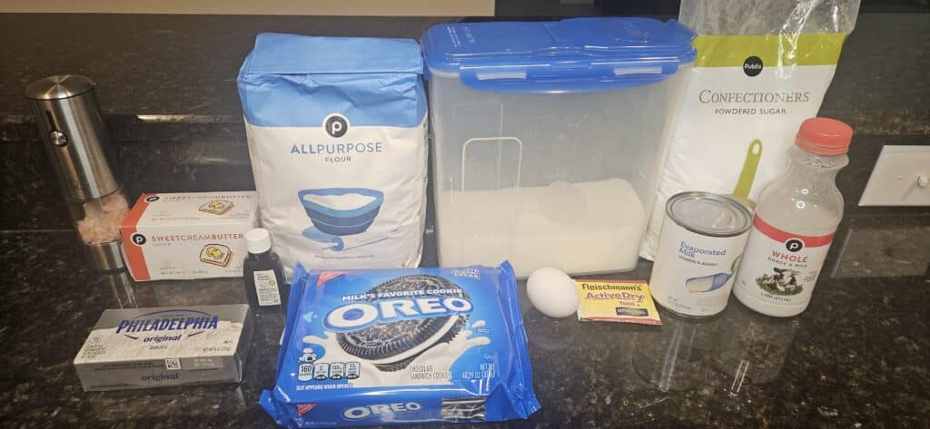 Beignets From Beyond Recipe Ingredients: Salt, Butter, Vanilla Extract, Cream Cheese, Flour, Oreos, Sugar, Egg, Active Dry Yeast, Confectioners Sugar, Evaporated Milk, Whole Milk