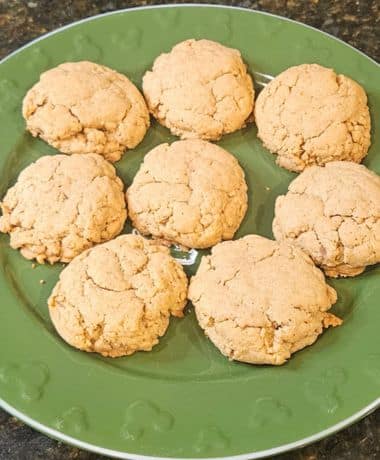 Disneyland Pumpkin Cookies Recipe: 8 cookies on a green plate with Mickey Mouse emblems around the edge.
