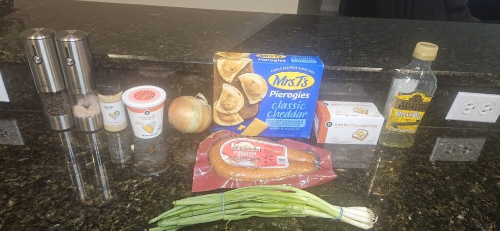 EPCOT Potato Pierogis Ingredients: Salt, Pepper, Sour Cream, Onion, Kielbasa, Green Onion, Frozen Pierogis, Butter, Olive Oil