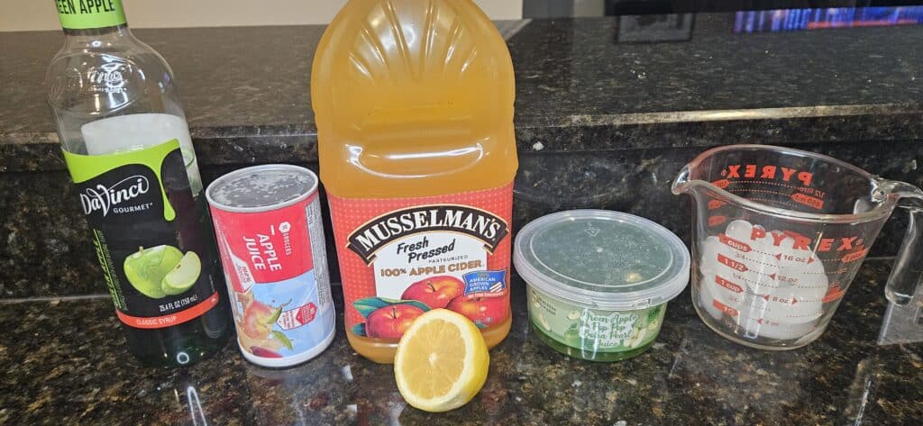 Frozen Apple Cider with Green Apple Boba Ingredients: Green Apple Syrup, Frozen Apple Juice Concentrate, Apple Cider, Lemon, Green Apple Popping Boba, Ice