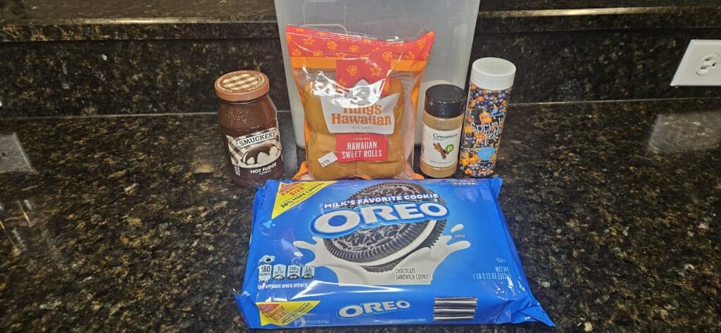 Haunted Hawaiian Rolls Recipe Ingredients: Hot Fudge, Oreos, Sugar, King's Hawaiian Original Sweet Rolls, Cinnamon, Halloween Sprinkles